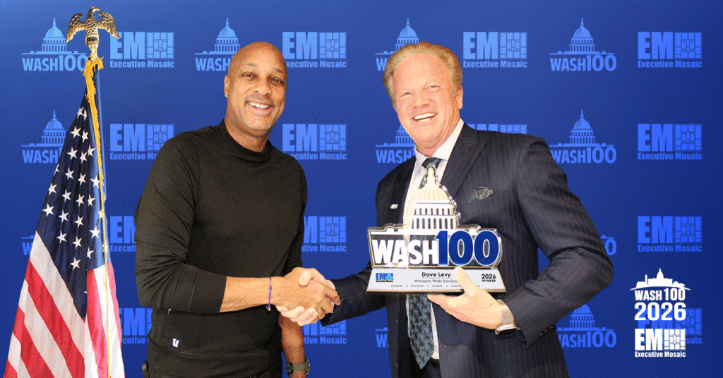 Levy & Garrettson. AWS Worldwide Public Sector VP Dave Levy accepted the 2026 Wash100 Award from EM CEO Jim Garrettson.