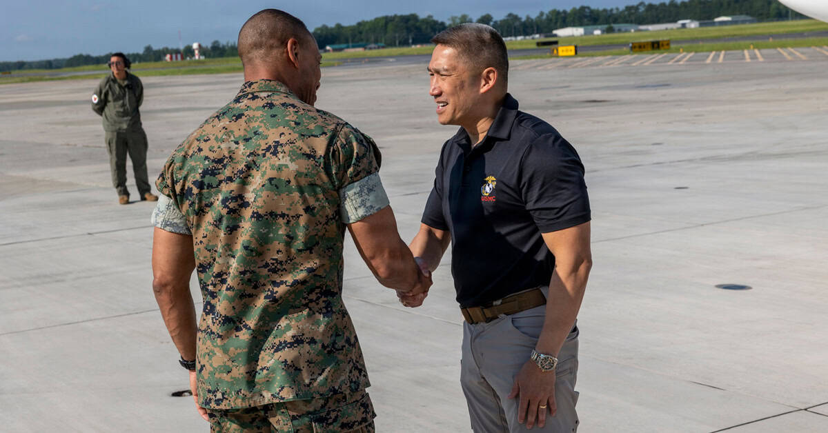 Hung Cao, acting Navy secretary (right), greets Lt. Gen. Calvert L. Worth Jr., the commanding general of II Marine Expeditionary Force, at Marine Corps Air Station New River, North Carolina, July 29, 2026. Photo: USMC Hung Cao. The acting Navy secretary (right) greets Lt. Gen. Calvert L. Worth Jr. on July 29, 2026.